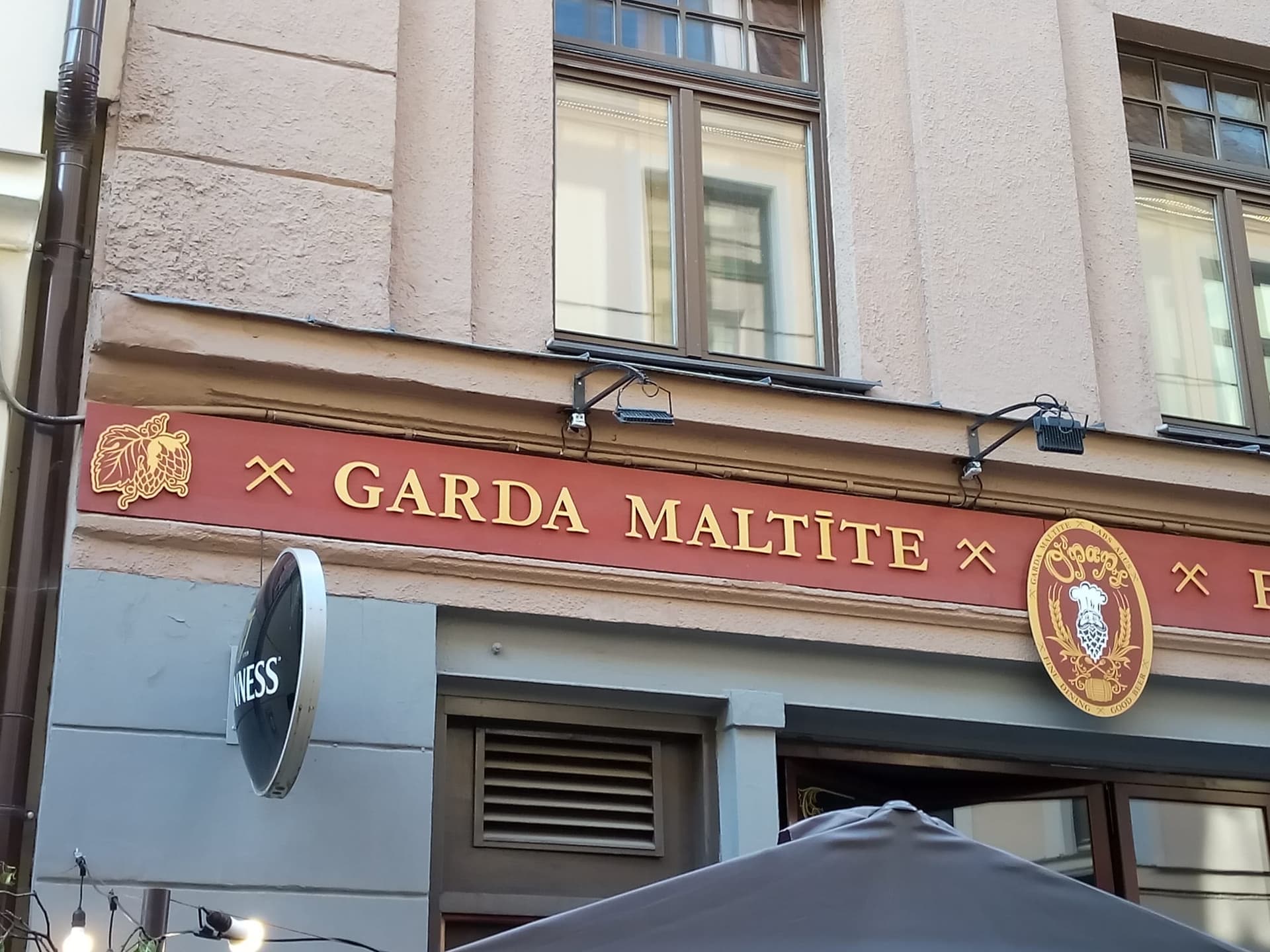 Café corner window on Miera iela, 3.2 × 2.1 m, facing the tram stop — Centrs, Riga